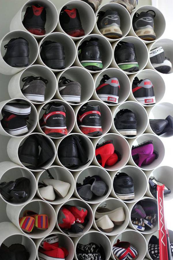Shoes have been arranged in partially cut out tubes.