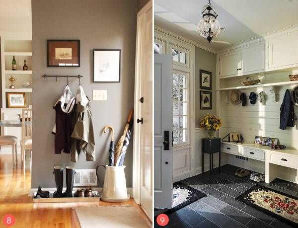 Wooden dividers and hooks organizing an entryway and mudroom of a home.