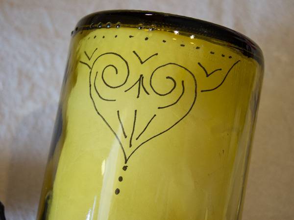 An inverted wine bottle used for making a lamp.