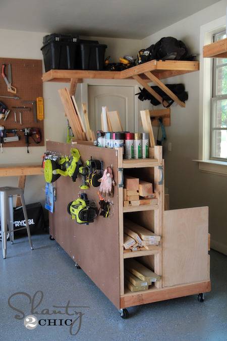 A shelf containing pieces of various wood and construction tools.