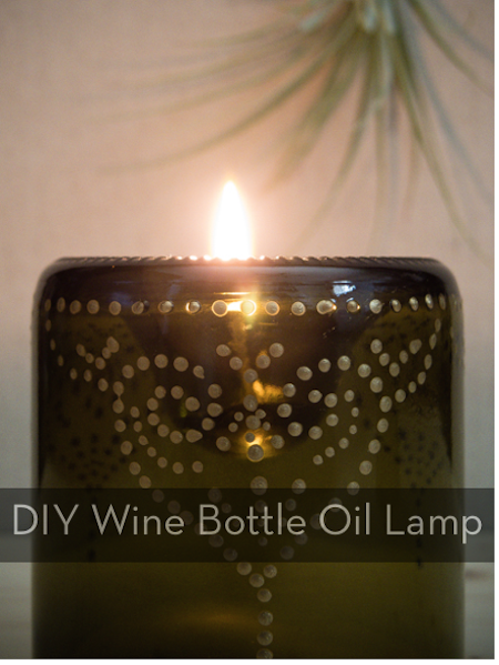 A wine bottle turned into an oil lamp.