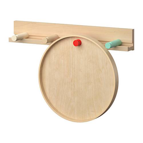 A wooden disk is hanging from a rack on the wall.