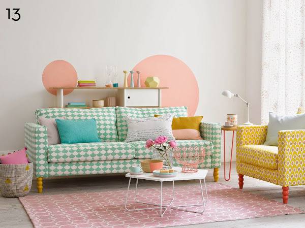 Checkered sofa with pillows near yellow chair with hexagonal table.