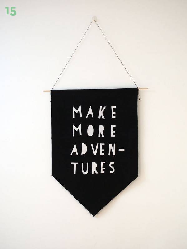 A black banner has the words Make More Adventures on it in white.