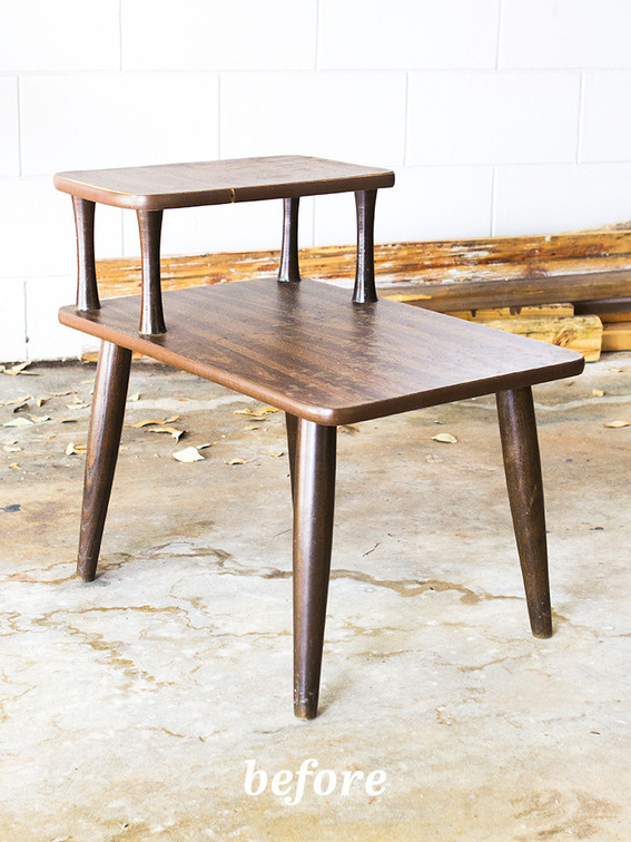 Dark wood side table with another small side table resting on top of it.