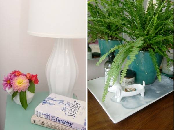 Plants, a lamp and other objects are arranged on side tables.