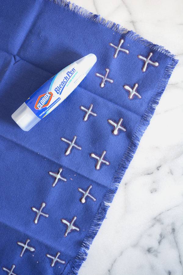 A blue napkin and a bleach pen