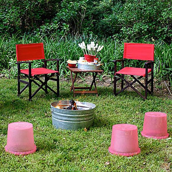 red chairs outside a patio with a bucket of wine