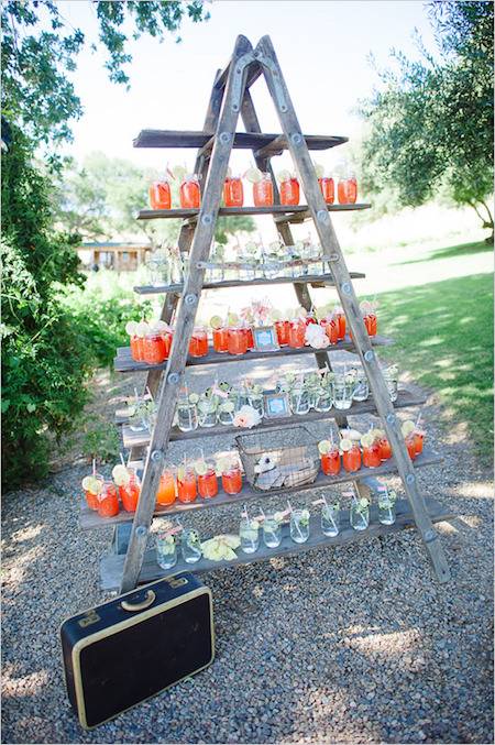 Colorful candles are on a pyramid shaped stand.