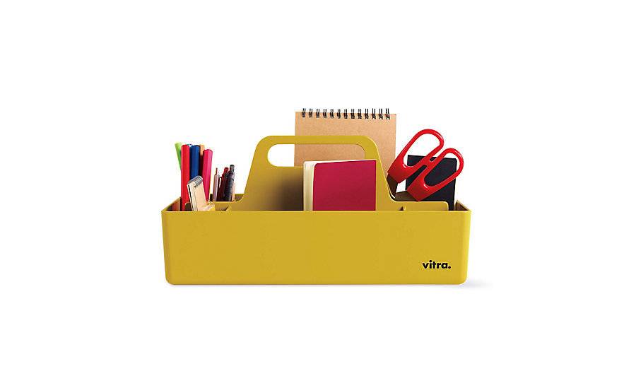 School tools are set in a yellow basket.