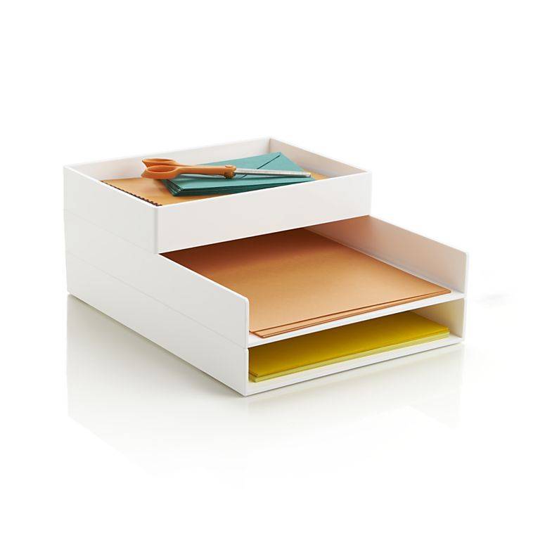 Manila folders, and yellow folders are in a white desk organizer with scissors on the top shelf.