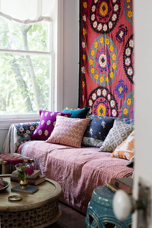 Beautiful Bohemian Spaces - bohemian textiles in living room (Design Sponge)
