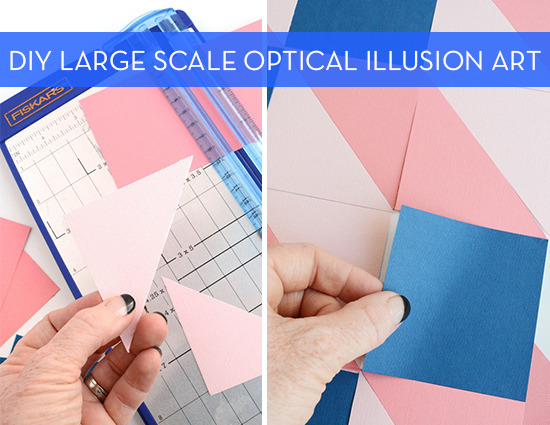 A person holding triangular pieces of pink paper over a paper cutter and a person holding a blue piece of square blue paper over squares of pink and white paper.