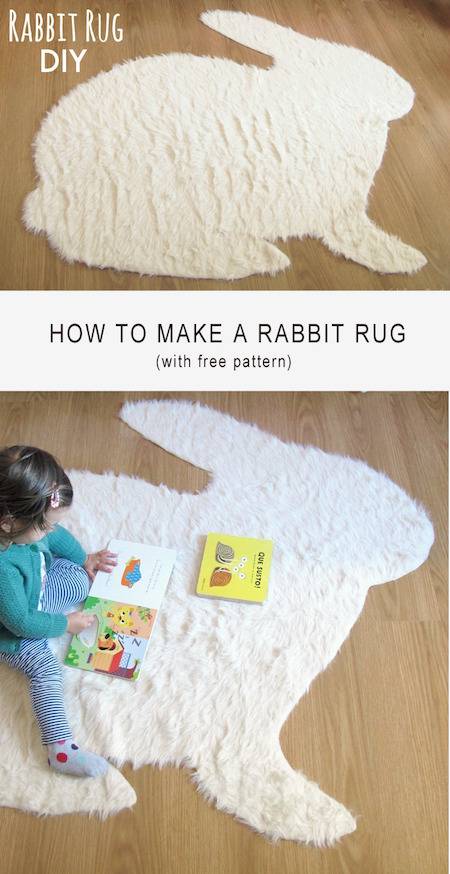 A child is playing on a rug that looks like a rabbit.