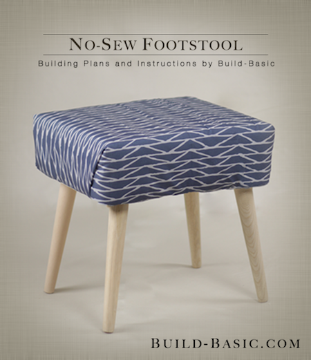 Blue color footstool with four legs.