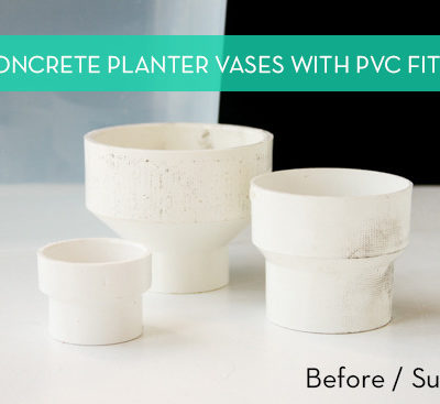 White concrete planter vases laying next to each other.