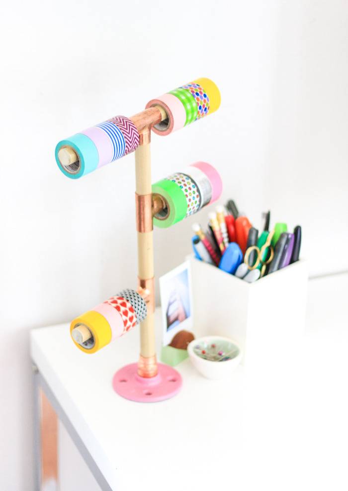 Wooden dowel rods can hold rolls of washi tape.