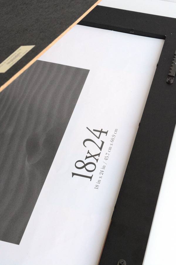 An 18"x24" black picture frame.