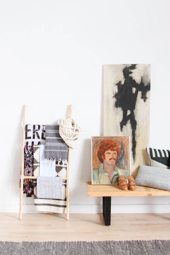 Pictures are sitting on a grey colored desk.