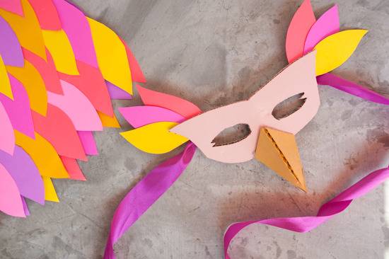 A colorful bird costume made of cardboard.