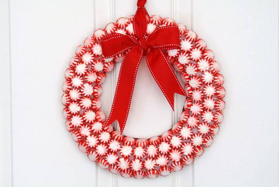 A red and white circular decorative piece with a red bow