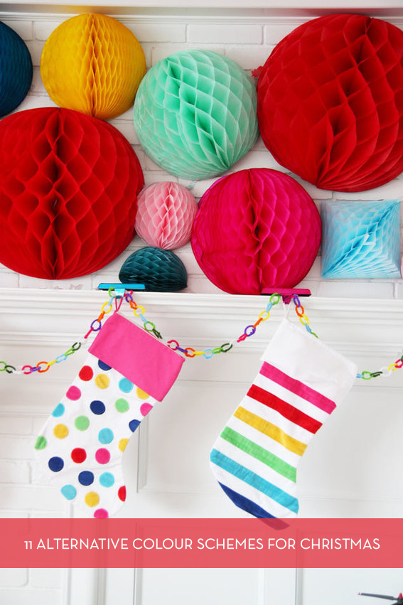 Several multicolored Asian balloons are above two colorful stockings.