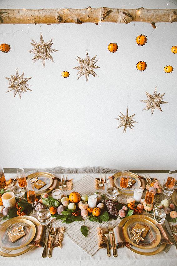 Christmas decorations over a decorated table.