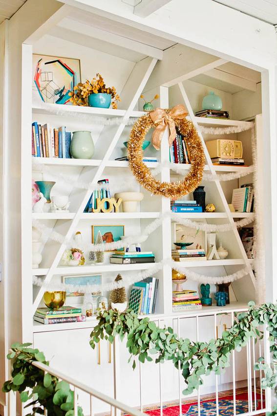 A shelving unit decked out for Christmas.