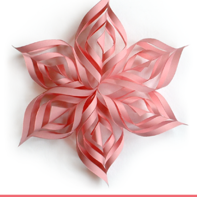 Pink colored paper snowflake.