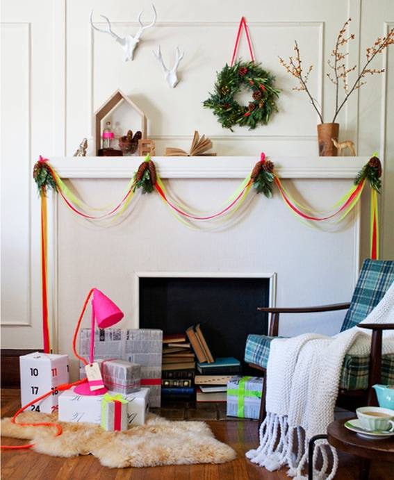 a home hearth filled with books and decorated with streamers and a Christmas theme.