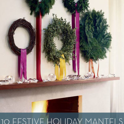 White fireplace with five various wreaths above the mantel.