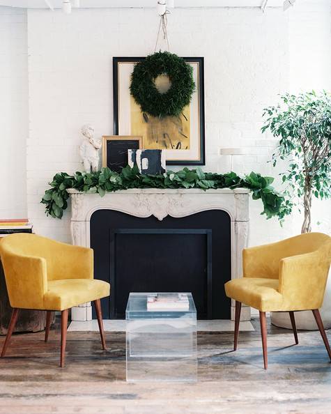 Yellow chairs   and plants in a hall."