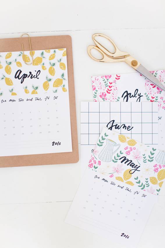 A person is designing a calendar with the summer months.