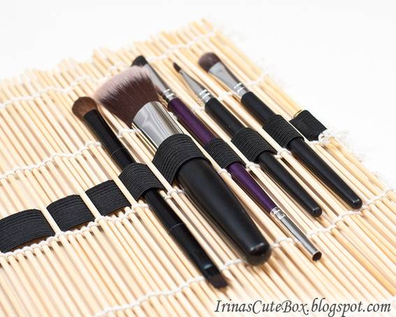 Makeup brushes are set up in a rolling kit.