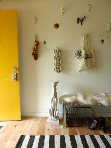 Different types of wall decors and dog statue are inside the room.