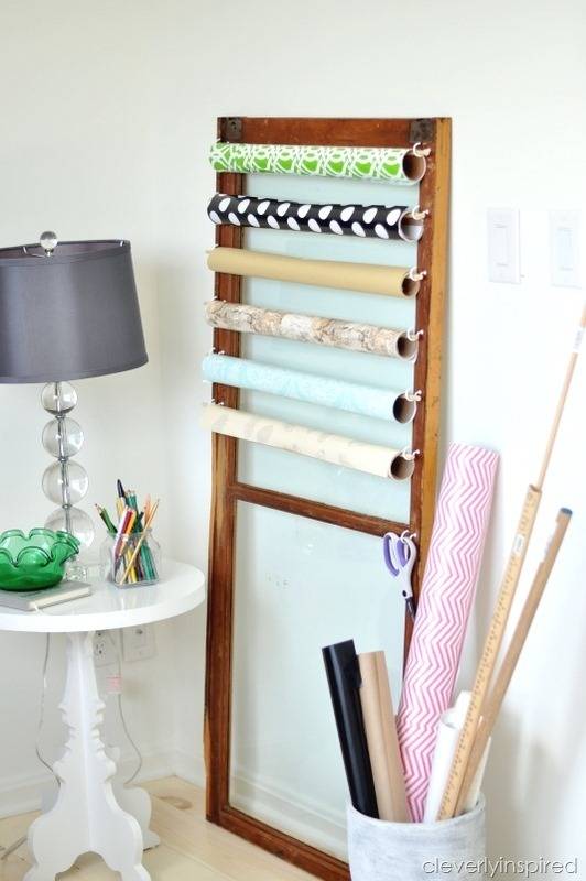 Gift wraps are arranged to a wooden holder.