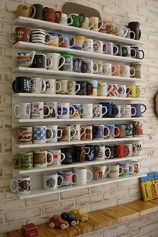 Kitchen cabinet with full of cups.