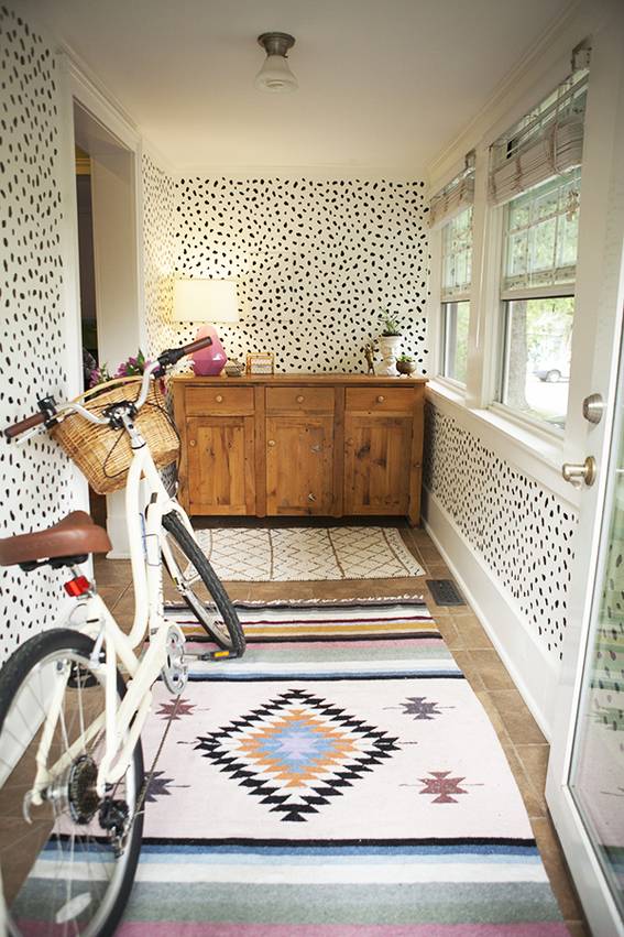 Bicycle, wood cabinet, table lamp on the mudroom.