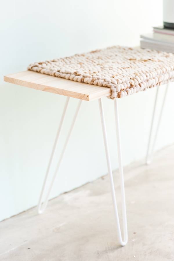 Table with wooden worktop covered with cloth mat.