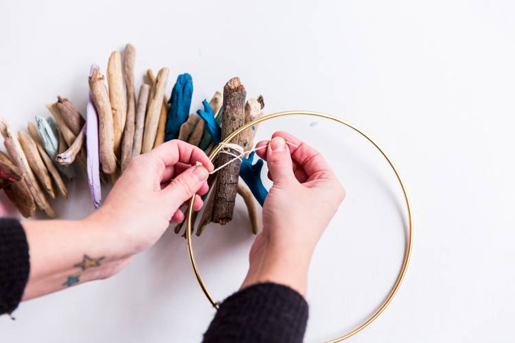 A person starting a hoop embroidery project.