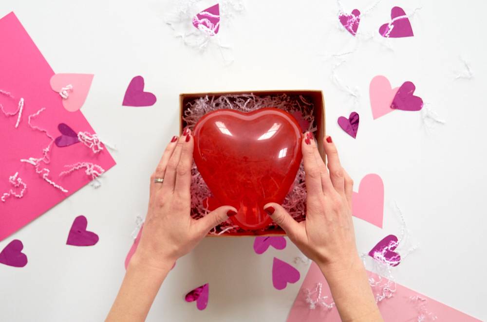 Place the balloon in the box