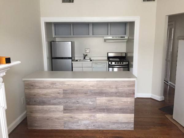After kitchen cabinet refacing with vinyl flooring