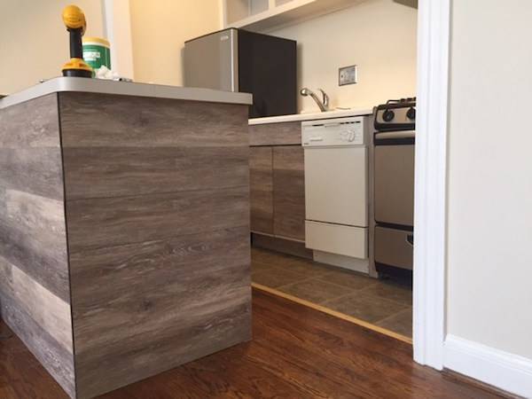 Before kitchen cabinet refacing with vinyl flooring