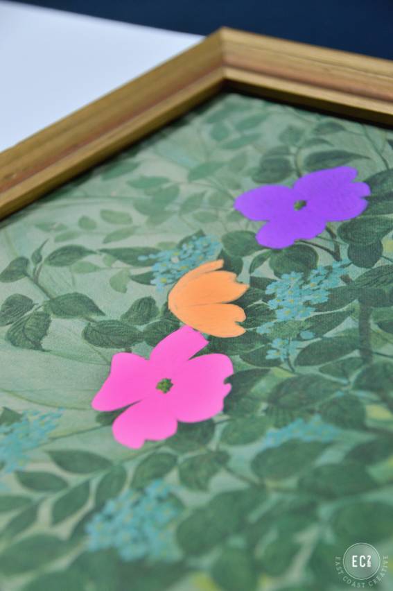 A painting with green and other colored paint on it.