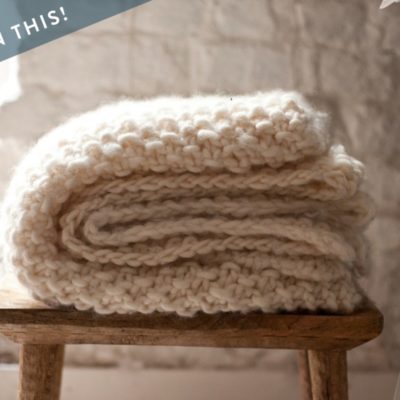 A folded knit blanket.