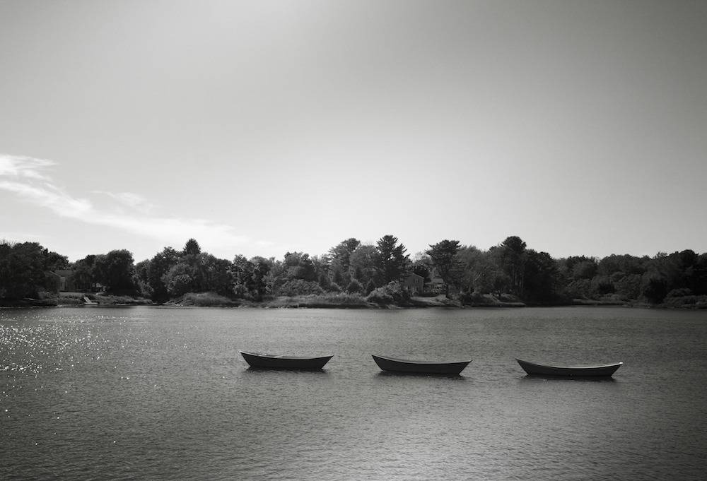 Black and white picture of boats on the water reservoir.