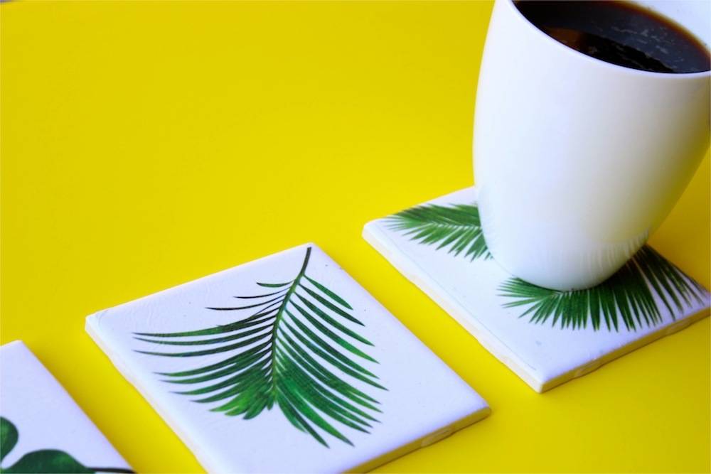 tropical leaf coasters and a cup of coffee