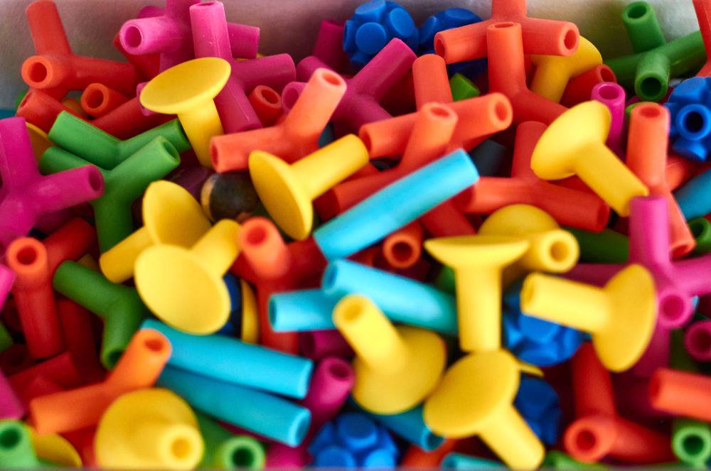 A pile of brightly colored connective toys.