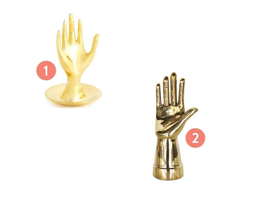 Brass hands with fingers open.