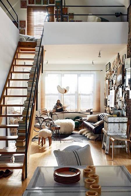 lofted space with beaconing staircase